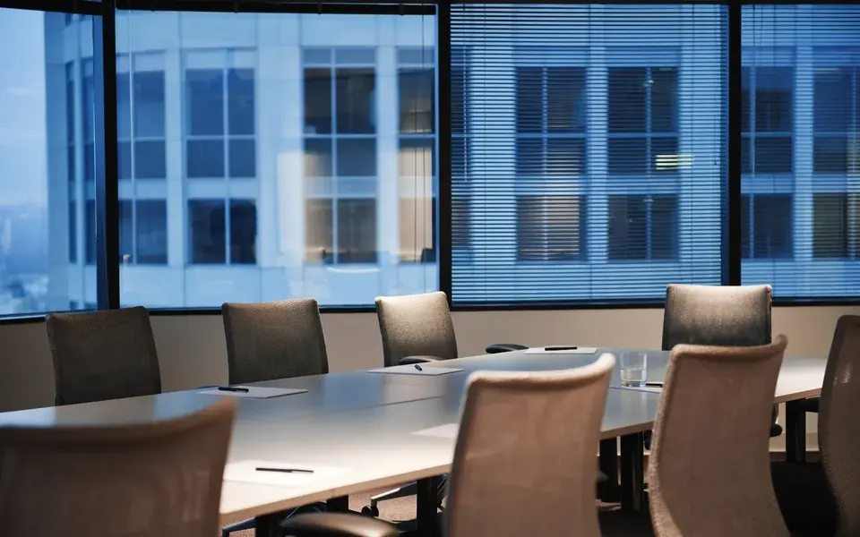 Executive boardroom set for a confidential legal engagement