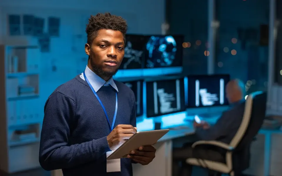 Software engineer reviewing code on a secure device