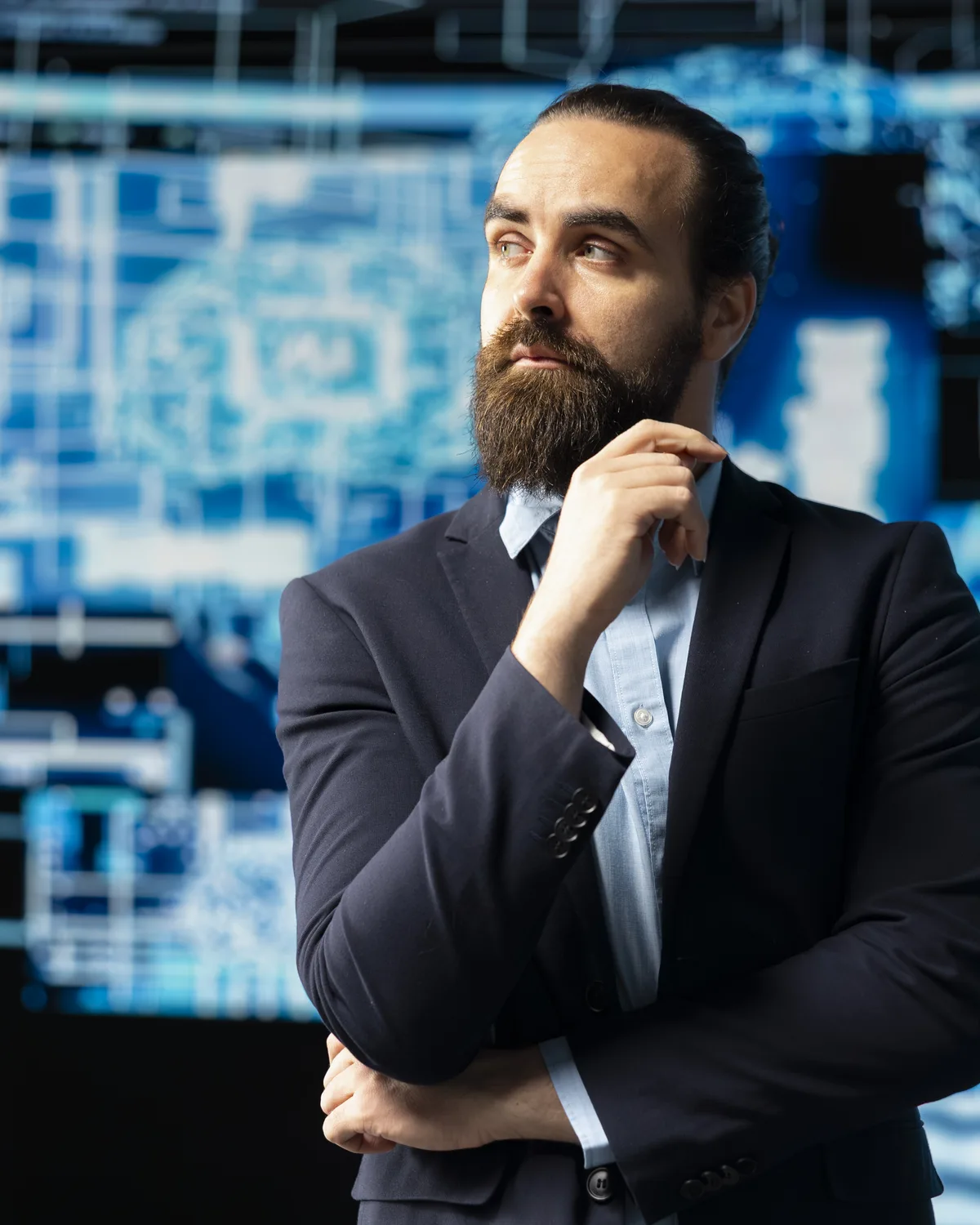 Glexia senior practitioner studying real-time threat intelligence on a data wall