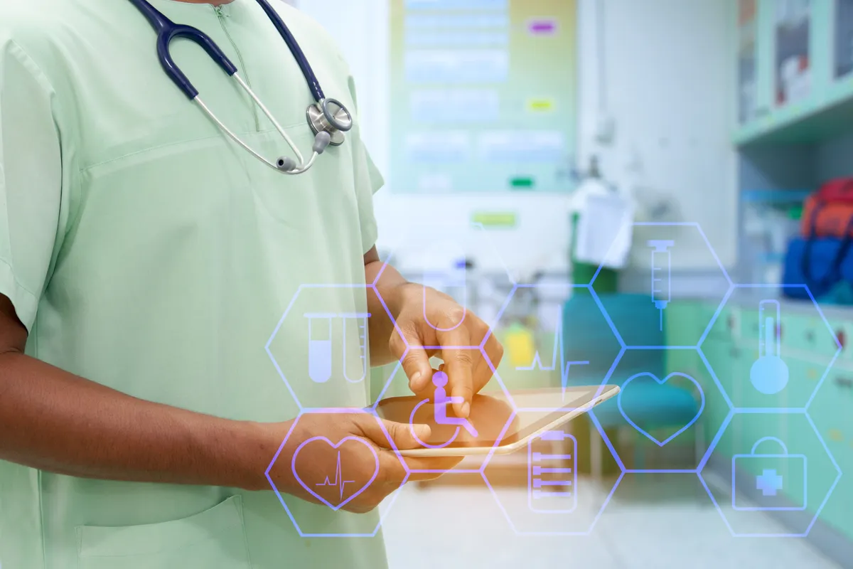 Clinician reviewing patient records on a connected healthcare device