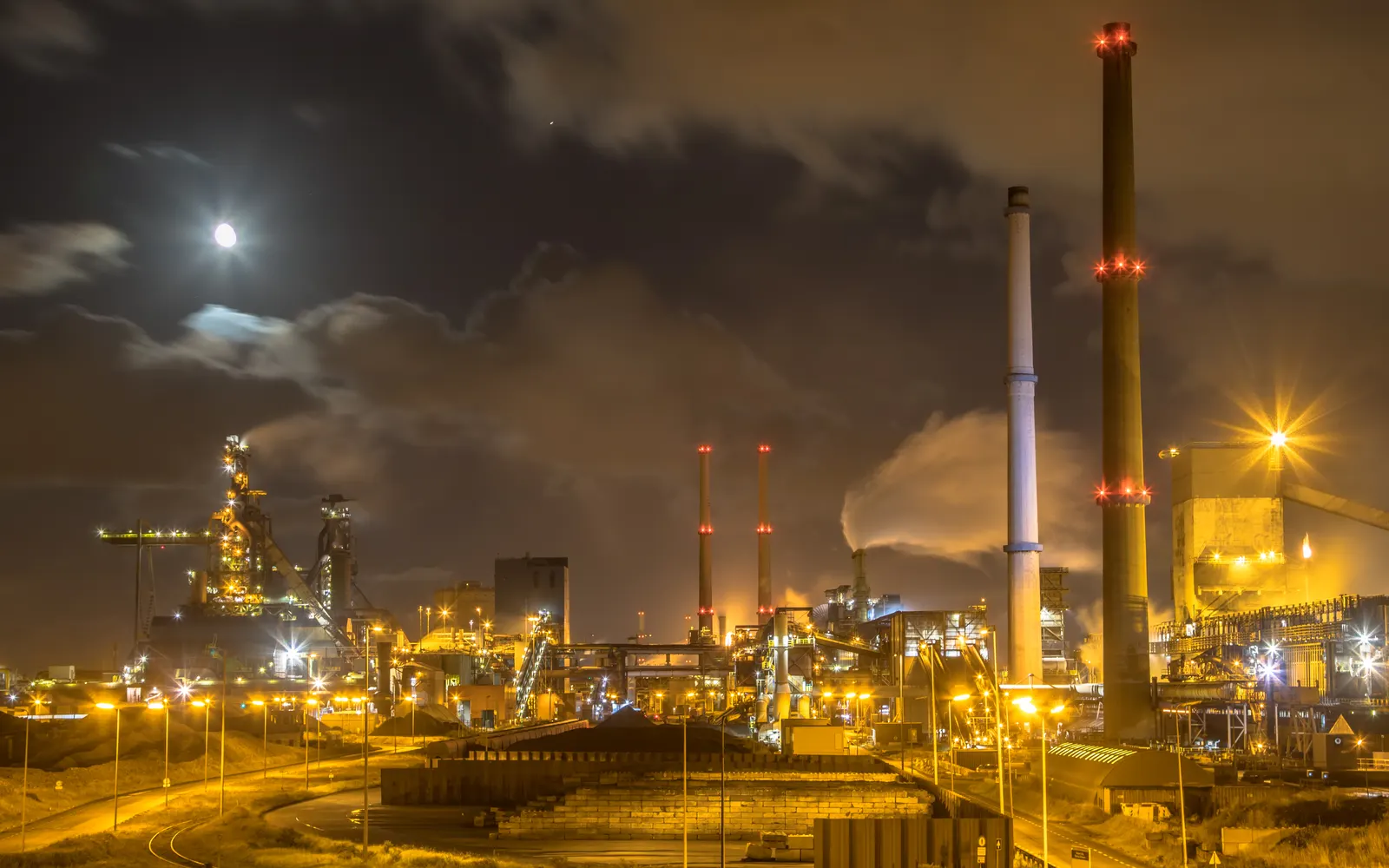Moonlit refinery infrastructure representing OT adversary tracking requirements
