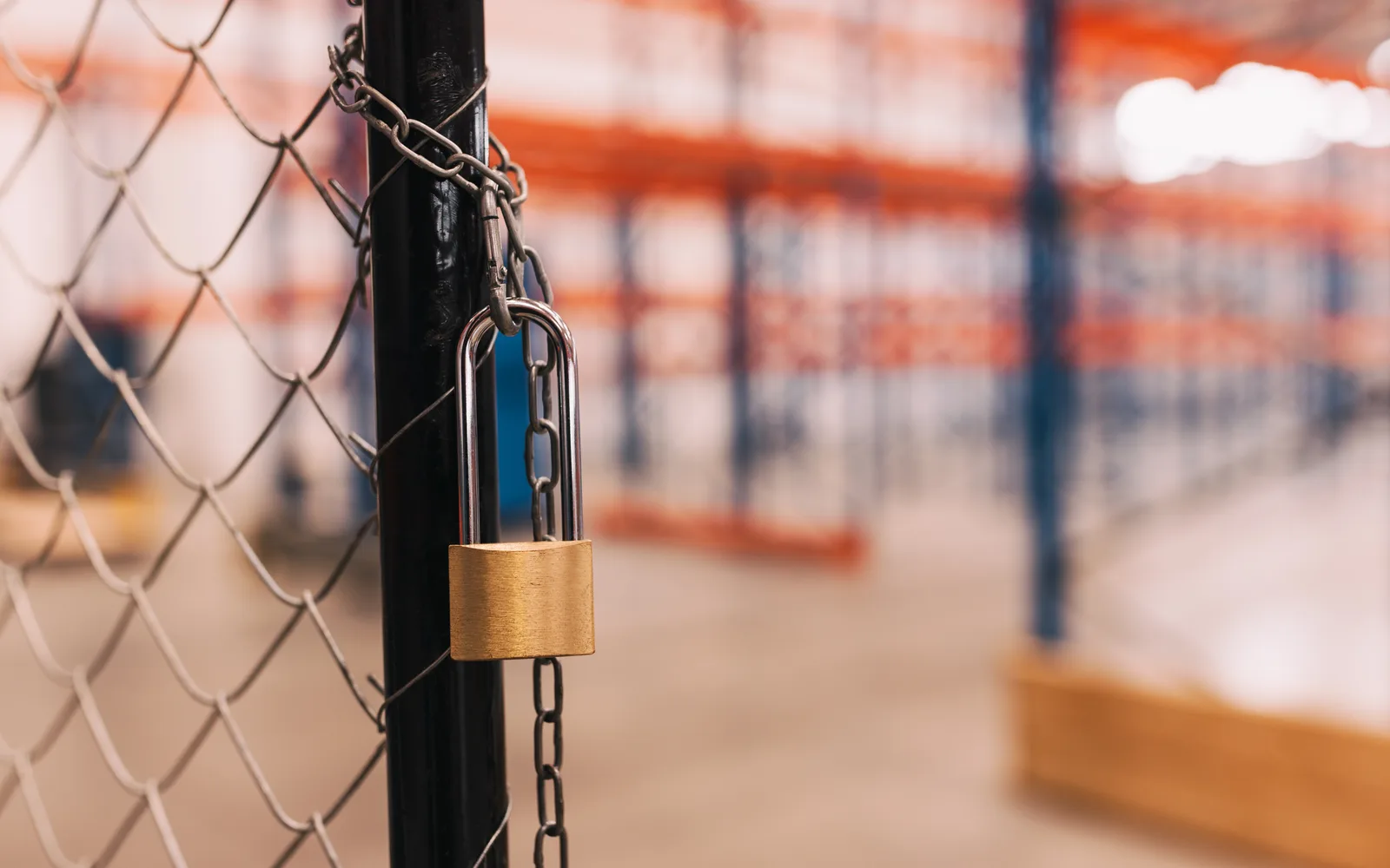 Padlocked perimeter gate representing segmented trust boundaries