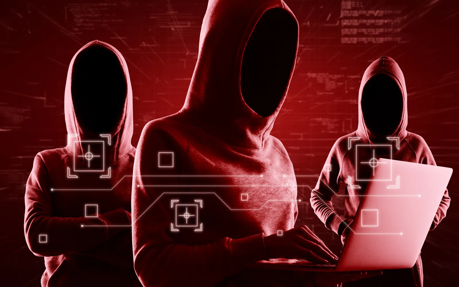 Red team operators silhouetted in red light